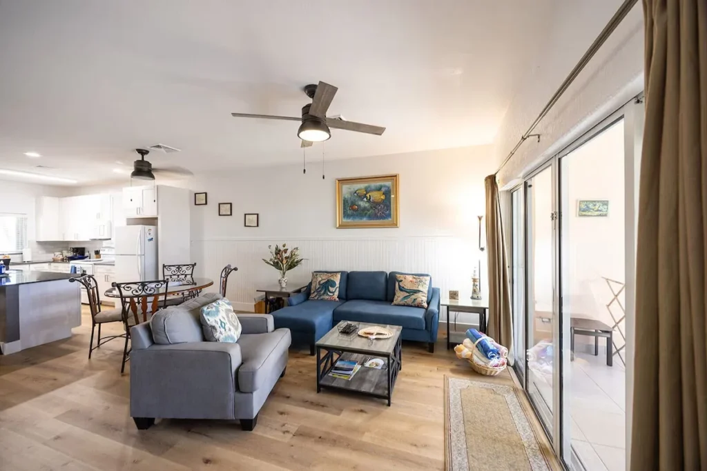 Bright open-plan living room with comfortable seating and dining area